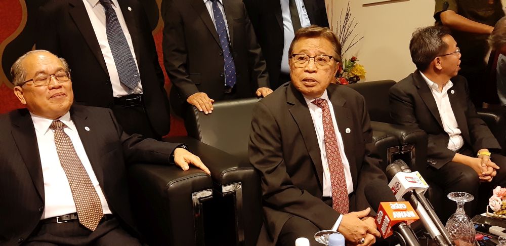 Datuk Patinggi Abang Johari Openg (centre) speaks to reporters after officiating the state-level Interfaith Harmony Week at the Islamic Information Centre in Kuching March 3, 2020. u00e2u20acu201d Picture by Sulok Tawie