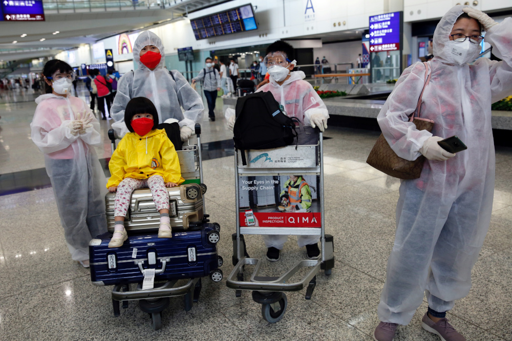 Passengers wear protective suits, amid the outbreak of coronavirus, at Hong Kong International Airport, Hong Kong, China March 17, 2020. u00e2u20acu201d Reuters pic 