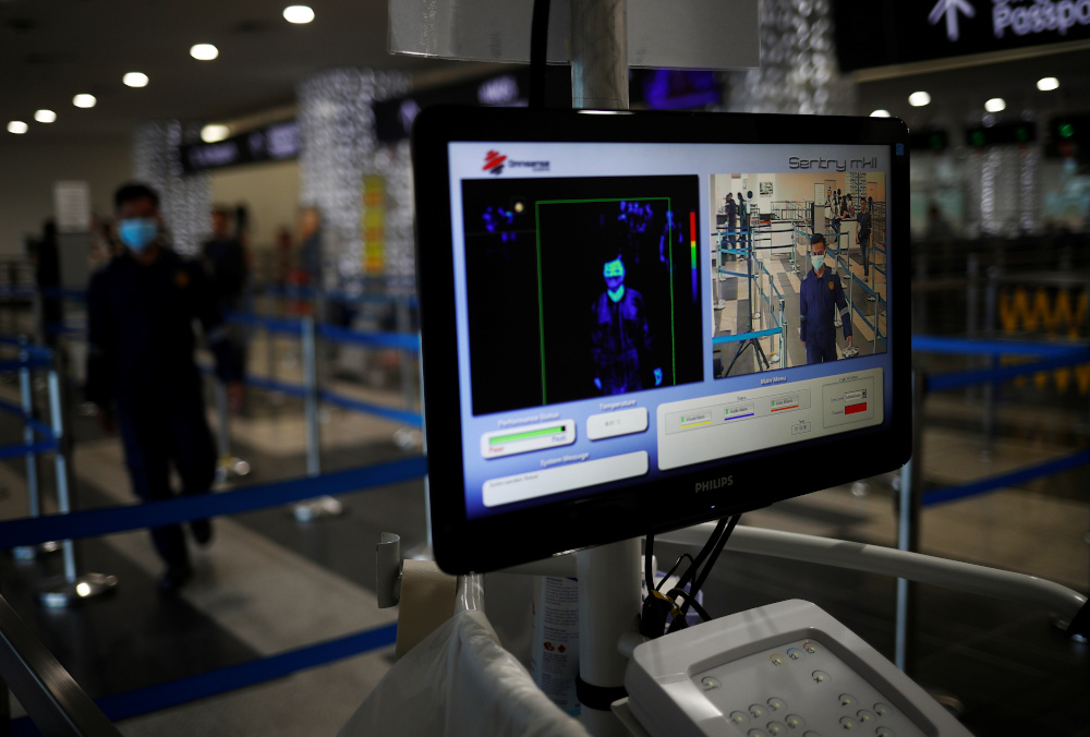 People arriving from Batam, Indonesia pass a temperature screening station at Singapore Cruise Centre, following the Covid-19 outbreak in Singapore March 5, 2020. u00e2u20acu201d Reuters pic 