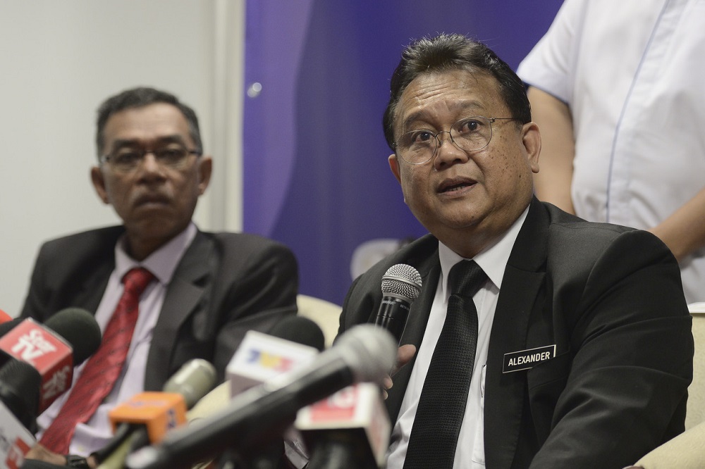 Domestic Trade and Consumer Affairs Minister Datuk Alexander Nanta Linggi (right) speaks during a press conference in Putrajaya March 17, 2020. u00e2u20acu201d Bernama pic