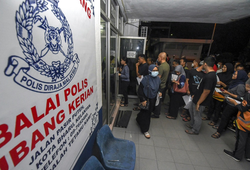 A group of people are seen gathering outside the Kubang Kerian police station in Kota Baru March 17, 2020. u00e2u20acu201d Bernama pic