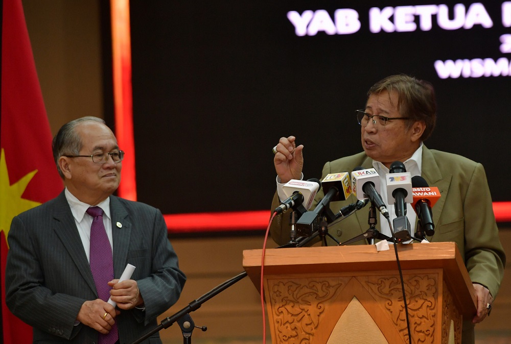 Sarawak Chief Minister Datuk Patinggi Abang Johari Openg (right) at a press conference in Kuching March 23, 2020. u00e2u20acu201d Bernama pic