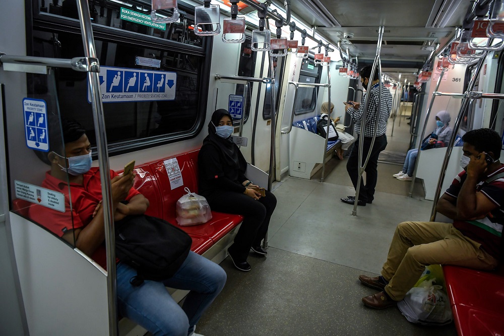 People are seen practising social distancing during an LRT ride in Kuala Lumpur March 24, 2020. u00e2u20acu201d Bernama pic