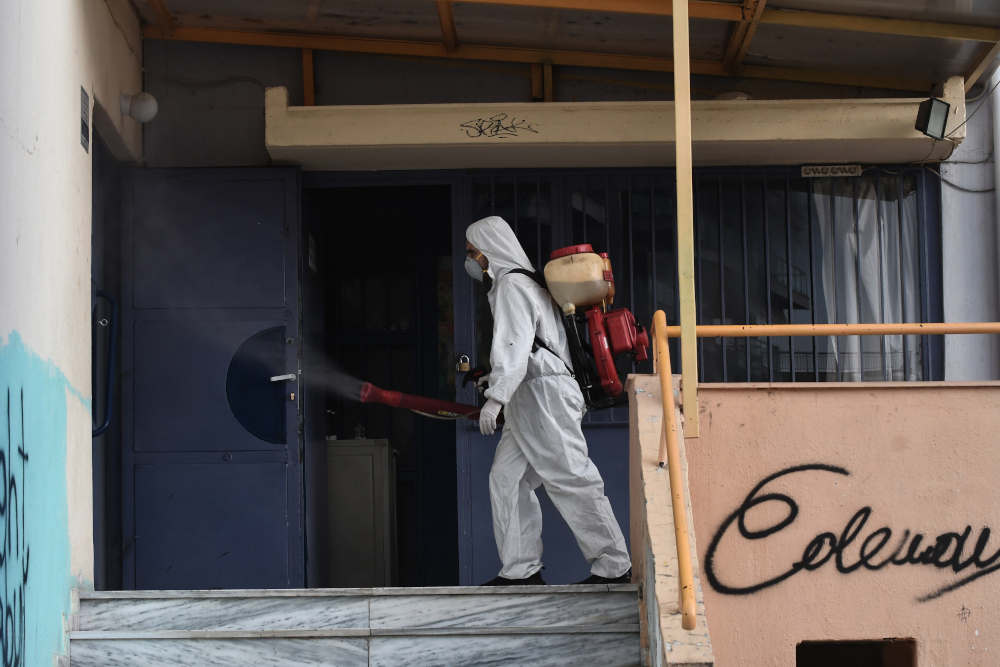A worker sprays disinfectant as part of preventive measures against the spread of the Covid-19, the novel coronavirus in a school in Thessaloniki, northern Greece, February 27, 2020. u00e2u20acu201d AFP pic 