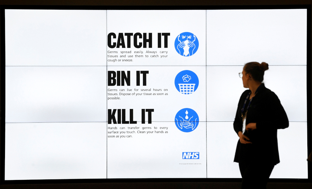 A visitor walks past a public information campaign advertisement during the annual conference of the British Chambers of Commerce in London, Britain, March 5, 2020. u00e2u20acu201d Reuters pic 