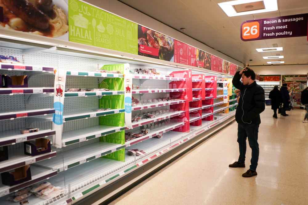 A man stands next to shelves empty of fresh meat in a supermarket, as the number of worldwide coronavirus cases continues to grow, in London March 15, 2020. u00e2u20acu2022 Reuters pic