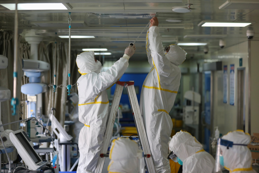 Medical workers in protective suits disinfect an intensive care unit (ICU) ward of Union Jiangbei Hospital in Wuhan, the epicentre of the Covid-19 outbreak, Hubei province, China March 12, 2020. u00e2u20acu201d China Daily pic via Reuters 