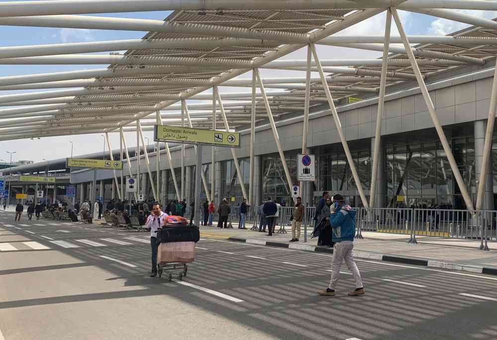 A man pulls his luggage upon his arrival at Cairo International Airport (CAI), as Egypt ramps up its efforts to slow the spread the coronavirus disease in Cairo March 19, 2020. u00e2u20acu2022 Reuters pic