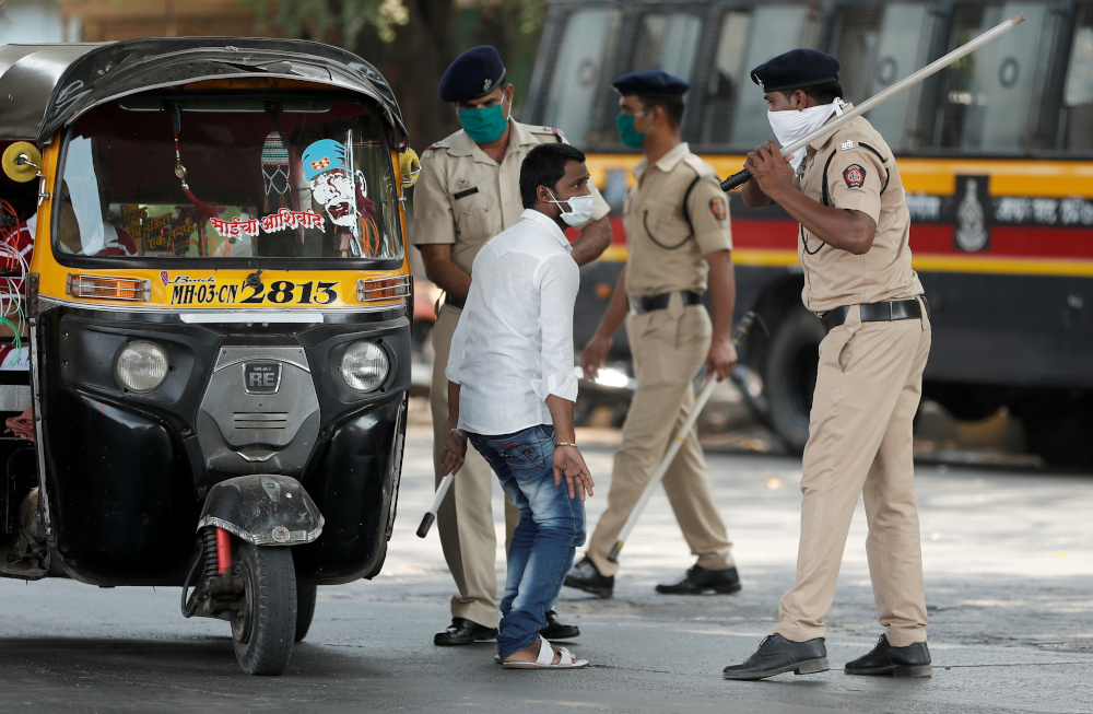 A policeman wields his baton at an autorickshaw rider as punishment for breaking the lockdown rules, after India ordered a 21-day nationwide lockdown to limit the spreading of coronavirus disease in Mumbai, India March 25, 2020. u00e2u20acu201d Reuters pic 