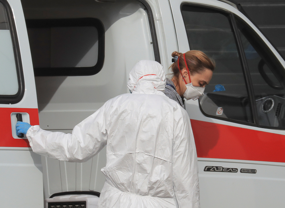 A woman wearing a protective mask gets out of an ambulance upon the arrival at a hospital for patients infected with coronavirus disease on the outskirts of Moscow, Russia March 19, 2020. u00e2u20acu201d Reuters picn