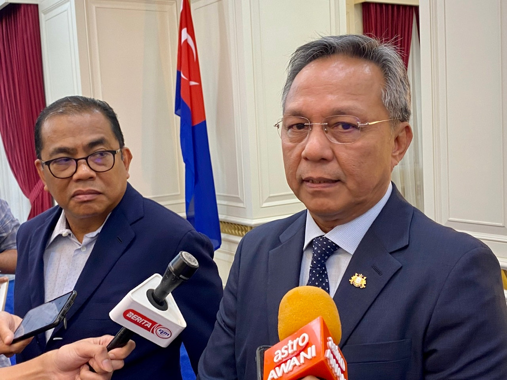 Johor Mentri Besar Datuk Hasni Mohammad (right) after receiving a courtesy call from Umno vice president Datuk Seri Mohamed Khaled Nordin (left) at the Johor Mentri Besaru00e2u20acu2122s Office in Kota Iskandar, Iskandar Puteri today. u00e2u20acu201d Picture by Ben Tann