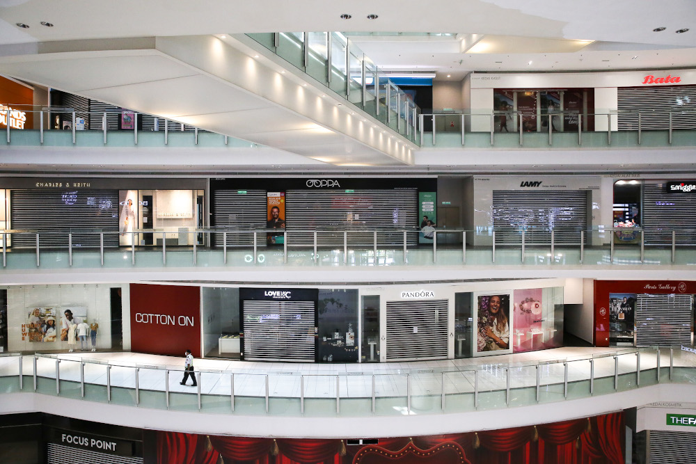 A security guard patrols inside a closed shopping mall in Kuala Lumpur March 21, 2020. u00e2u20acu201d Picture by Yusof Mat Isa