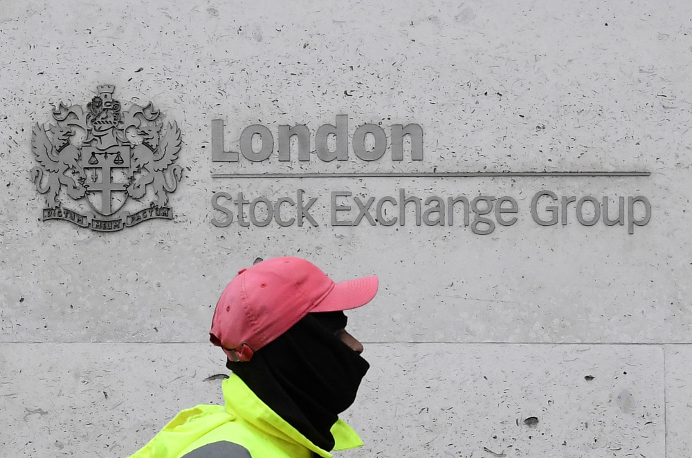 A street cleaning operative walks past the London Stock Exchange Group building in Londonu00e2u20acu2122s financial district March 9, 2020. u00e2u20acu201d Reuters pic 
