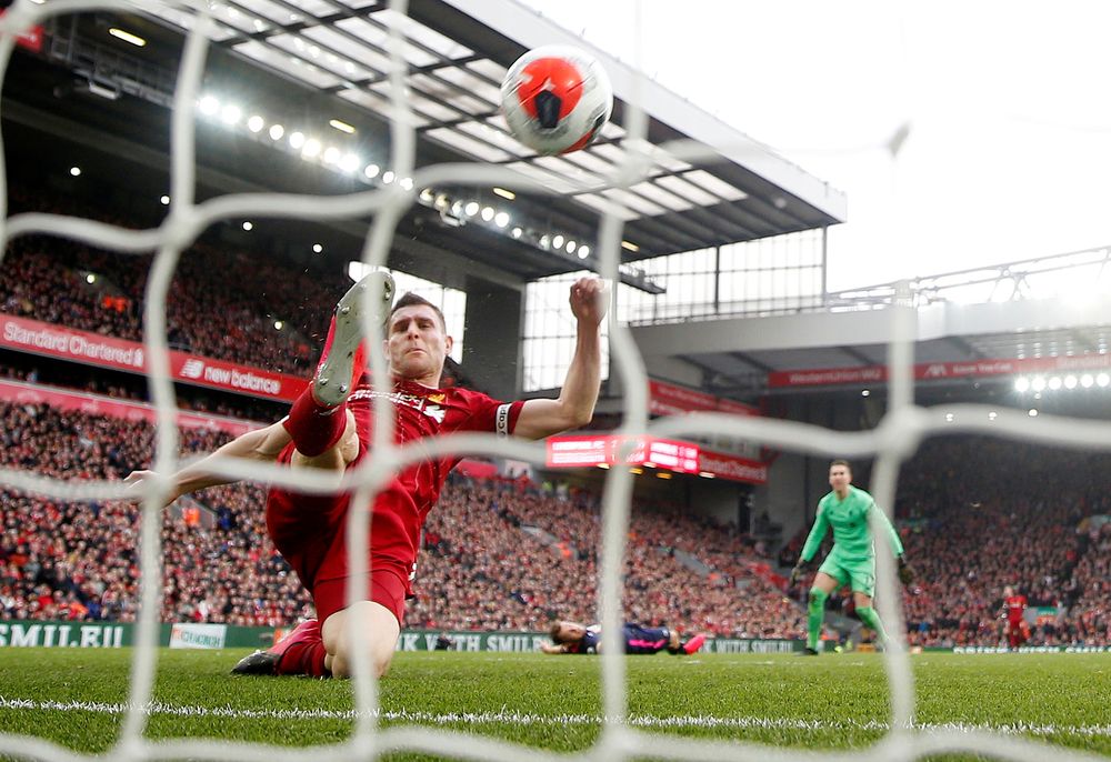 Liverpoolu00e2u20acu2122s James Milner clears the ball off the line during the  Premier League match Liverpool v AFC Bournemouth at Anfield, Liverpool, March 7, 2020. u00e2u20acu201d Action Images via Reuters