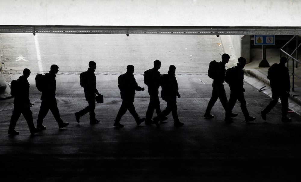 Members of the military arrive at the Excel Centre, London while it is being prepared to become the NHS Nightingale Hospital as the spread of the coronavirus disease (Covid-19) continues, London, Britain, March 28, 2020. u00e2u20acu201d Reuters picnn