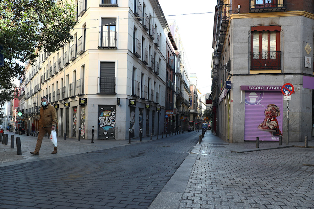 A man, wearing a protective mask, walks with his shopping bag through an empty street due to the coronavirus outbreak in central Madrid, Spain, March 14, 2020. u00e2u20acu201d Reuters picnnn