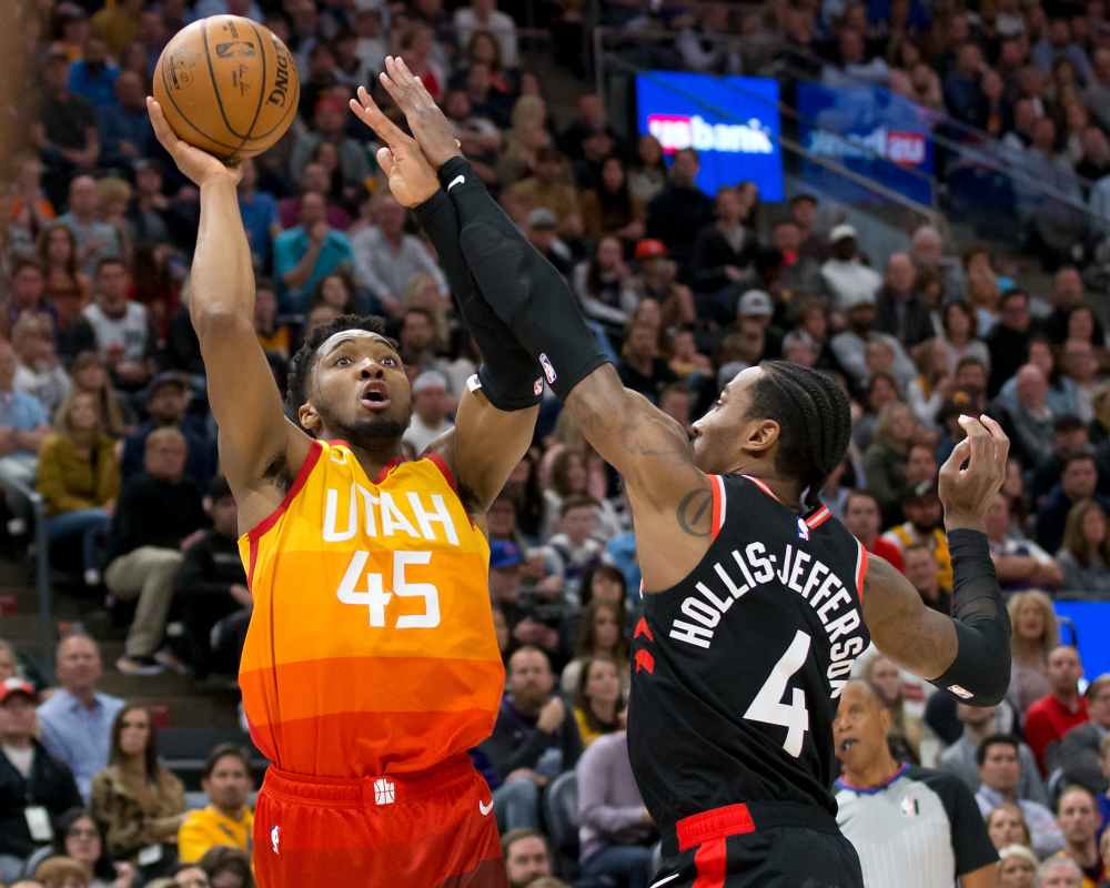 Utah Jazz guard Donovan Mitchell (45) shoots the ball against Toronto Raptors forward Rondae Hollis-Jefferson (4) during the second half at Vivint Smart Home Arena, March 9, 2020. u00e2u20acu2022 Picture by Russell Isabella-USA TODAY Sports via Reuters