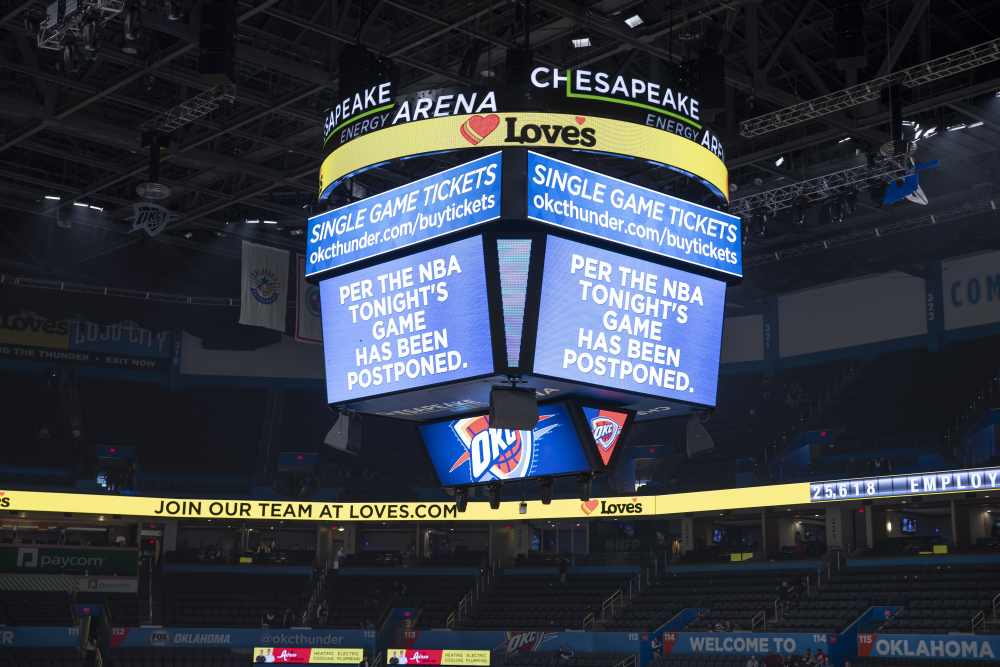 A message on the video score board informs fans the game against the Utah Jazz has been postponed, March 11, 2020. u00e2u20acu2022 Picture by Alonzo Adams-USA TODAY Sports via Reuters