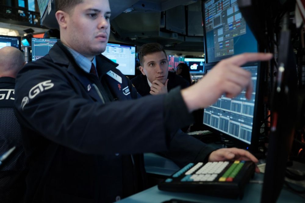 Traders work on the floor of the New York Stock Exchange (NYSE) on March 9, 2020 in New York City. As global fears from the coronavirus continue to escalate, trading was halted for 15 minutes after the opening bell as stocks fell 7 per cent. u00e2u20acu201d AFP pic
