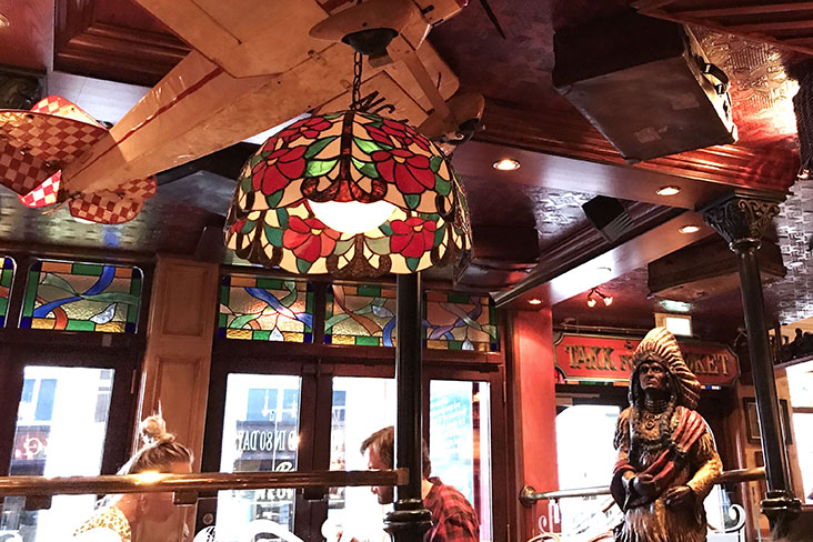 An eclectic décor with statue of a Sioux chief statue and model air planes