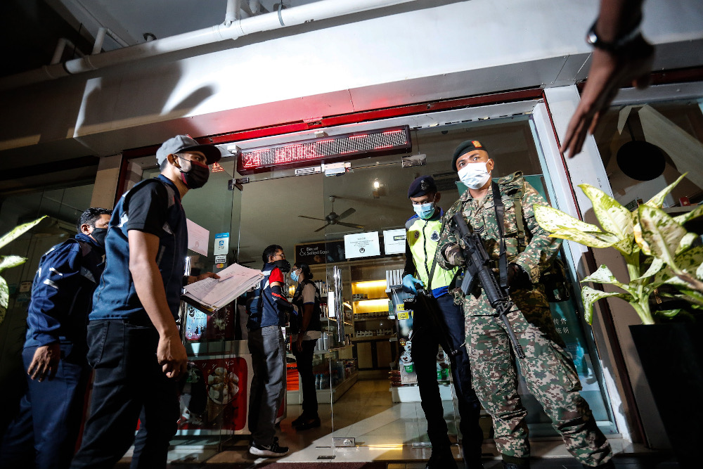 Shops around Georgetown were u00e2u20acu02dcambushedu00e2u20acu2122 by the Penang Island Municipal Council after operating beyond the designated time during an operation March 25, 2020. u00e2u20acu201d Picture by Sayuti Zainudin