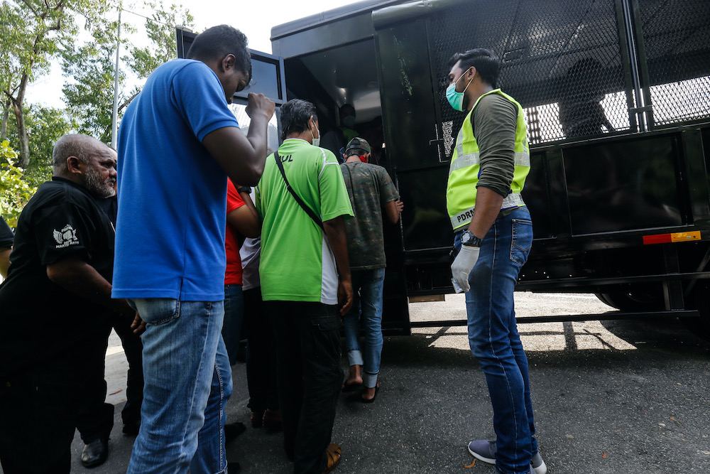 Police arrest youths who violate the movement control order in Jelutong, Penang, March 28, 2020. u00e2u20acu201d Picture by Sayuti Zainudi 