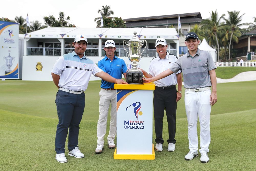 (From left) Joohyung Kim, Wade Ormsby, Charlie Wi and Ben Leong pose with the coveted Malaysian Open trophy. — Picture by Ahmad Zamzahuri