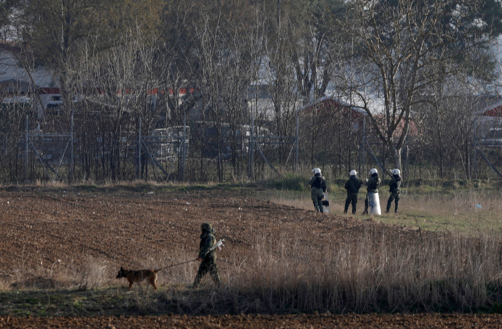 Greek riot police officers stand guard near Turkeyu00e2u20acu2122s Pazarkule border crossing, in Kastanies, Greece March 6, 2020. u00e2u20acu201d Reuters pic 