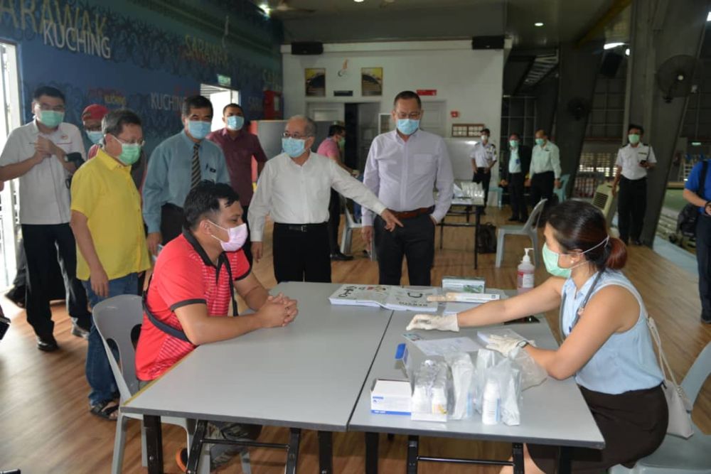 Deputy Chief Minister Datuk Amar Douglas Uggah (second from right) visits the Respiratory Clinic at the Indoor Stadium March 24, 2020. u00e2u20acu201d Picture courtesy of the Deputy Chief Ministeru00e2u20acu2122s Office
