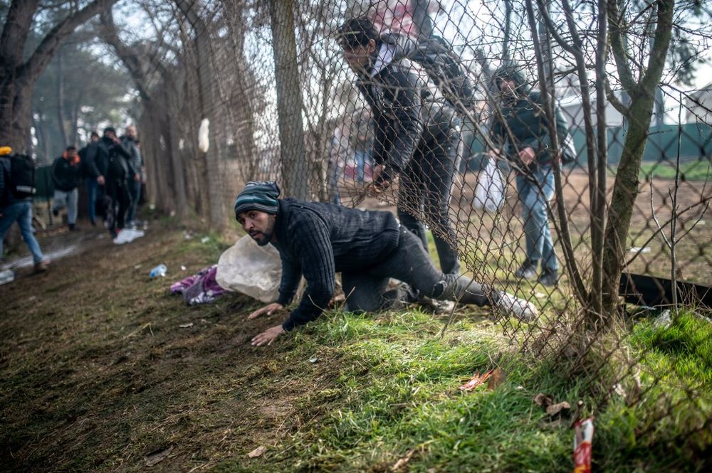 A migrant passes to the buffer zone during clashes with Greek police at the Turkey-Greece border, at Pazarkule, in Edirne district, on February 29, 2020. u00e2u20acu201d AFP pic