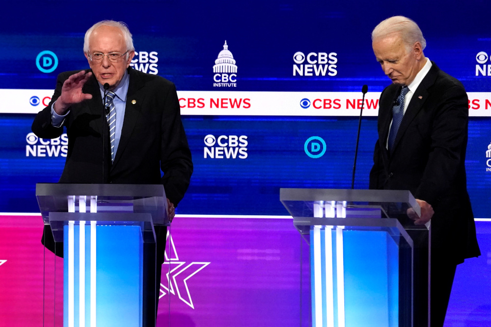Democratic 2020 US presidential candidates Senator Bernie Sanders makes a point as former Vice President Joe Biden listens at the tenth Democratic 2020 presidential debate at the Gaillard Center in Charleston, South Carolina, US February 25, 2020. u00e2u20acu201d Reu