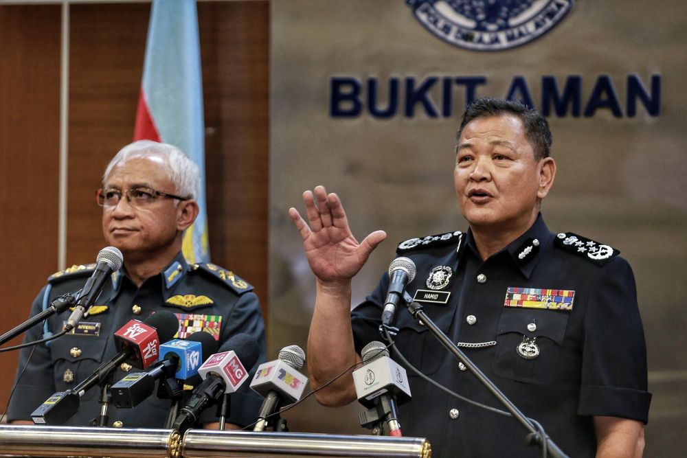IGP Tan Sri Abdul Hamid Bador (right) speaks during  a press conference at Bukit Aman March 2,2020. u00e2u20acu201d Picture by Ahmad Zamzahurinn
