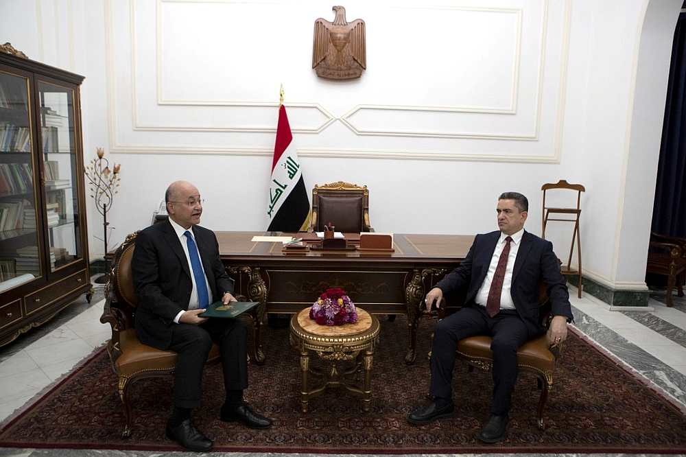 Iraq's President Barham Salih meets with new prime minister-designate Adnan al-Zurfi (right) in Baghdad, Iraq March 17, 2020. u00e2u20acu201d Presidency of the Republic of Iraq Office handout via Reuters