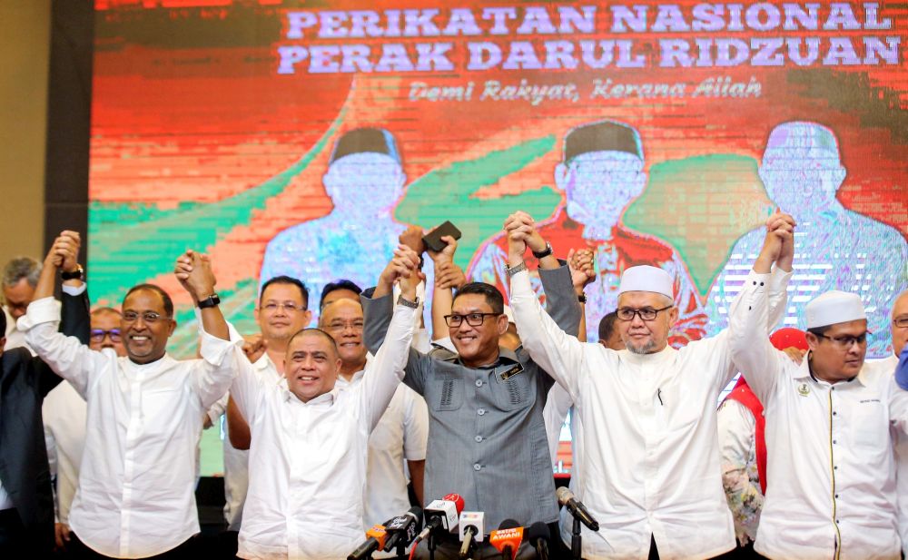 Perak Mentri Besar Datuk Seri Ahmad Faizal Azumu (centre) poses for a group picture with Perak Umno and PAS leaders after a press conference in Ipoh March 9, 2020. u00e2u20acu201d Picture by Farhan Najib
