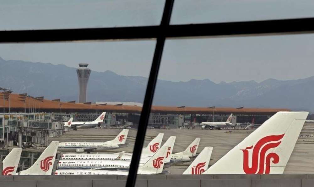 File picture shows Air China passenger jets being parked at Terminal Three of Beijing Capital International Airport September 28, 2010. u00e2u20acu201d Reuters pic