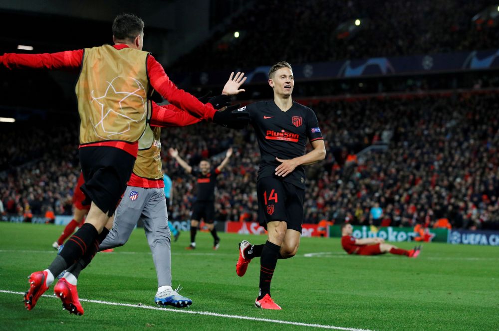 Atletico Madridu00e2u20acu2122s Marcos Llorente celebrates scoring their second goal against Liverpool at Anfield with teammates March 11, 2020. u00e2u20acu201d Reuters pic