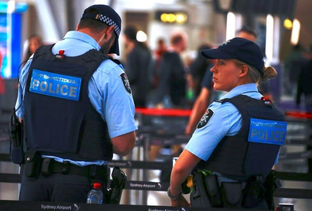 File picture shows Australian Federal Police officers standing near the check-in counters at the Sydney Airport Domestic terminal in Australia, July 30, 2017. u00e2u20acu201d Reuters pic