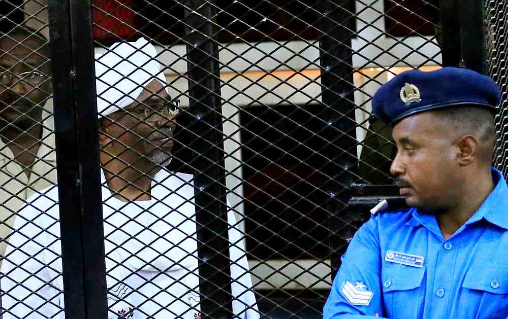 Sudan's former president Omar Hassan al-Bashir sits inside a cage during the hearing of the verdict that convicted him of corruption charges in a court in Khartoum, Sudan December 14, 2019. u00e2u20acu201d Reuters pic