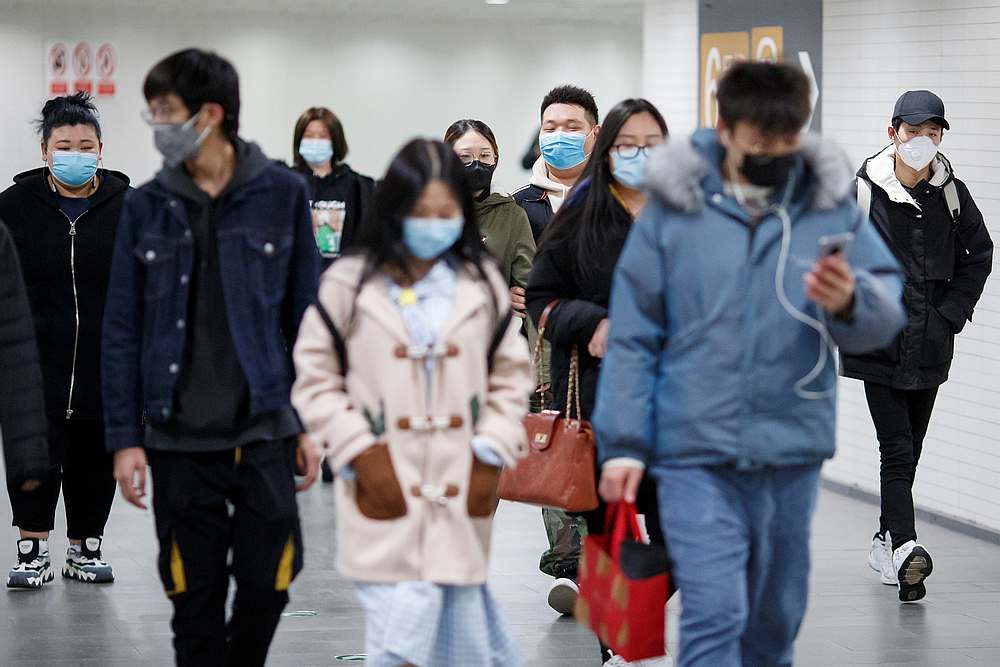 People wear protective masks in a subway tunnel during evening rush hour in Beijing, China March 10, 2020. u00e2u20acu201d Reuters pic 