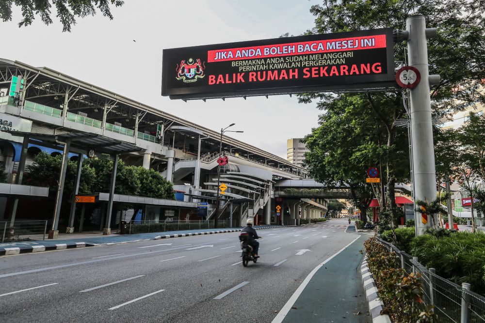 A billboard displaying a message on the movement control order is pictured in Kuala Lumpur March 31, 2020. u00e2u20acu201d Picture by Firdaus Latif