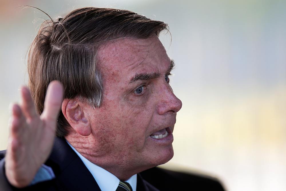 Brazil's President Jair Bolsonaro meets supporters as he leaves Alvorada Palace, as the spread of Covid-19 continues, in Brasilia, Brazil March 30, 2020. u00e2u20acu201d Reuters pic