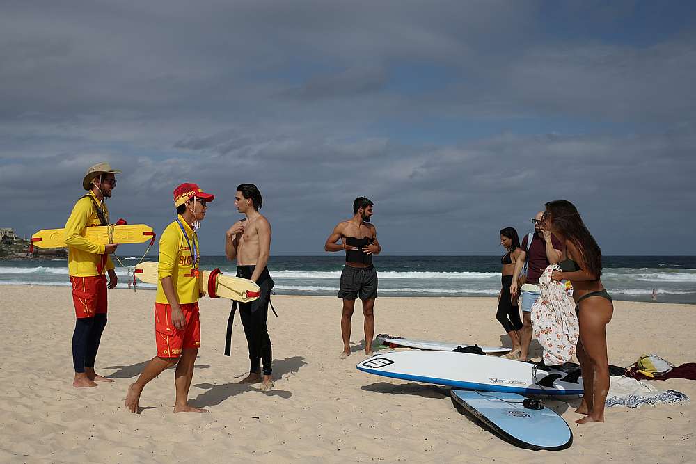 Surf rescue personnel enforce a closure of Bondi Beach to prevent the spread of Covid-19, in Sydney, Australia March 21, 2020. u00e2u20acu201d Reuters pic