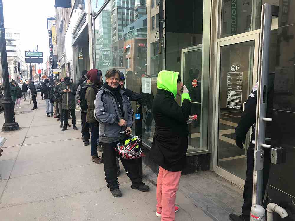 Customers queue in front of an official cannabis store of the Societe Quebecoise du Cannabis (SQDC) in central Montreal March 18, 2020. u00e2u20acu201d AFP pic
