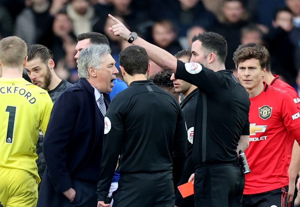 Everton manager Carlo Ancelotti is shown a red card by referee Chris Kavanagh after the match against Manchester United. u00e2u20acu201d Reuters pic