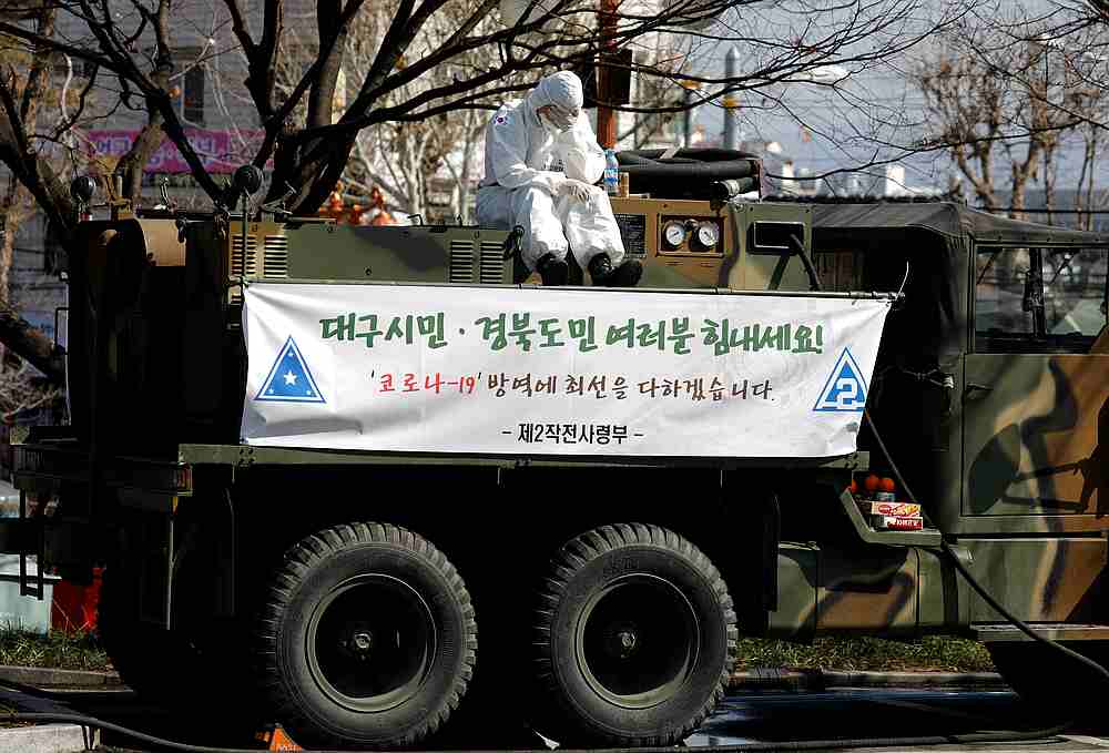 A soldier sits on atop a military vehicle for quarantine work at a screening facility for coronavirus patients at a hospital in Daegu, South Korea March 8, 2020. u00e2u20acu201d Reuters pic