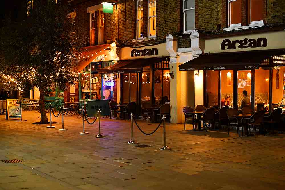A couple sit at a restaurant on usually busy street in Clapham, as the number of Covid-19 cases grow around the world, in London, Britain March 16, 2020. u00e2u20acu201d Reuters pic