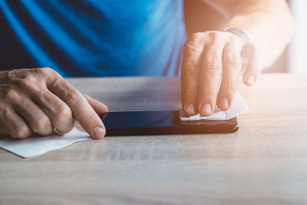 To stay safe from the coronavirus, you should regularly clean your electronic devices. u00e2u20acu201d djedzura/IStock.com pic via AFP