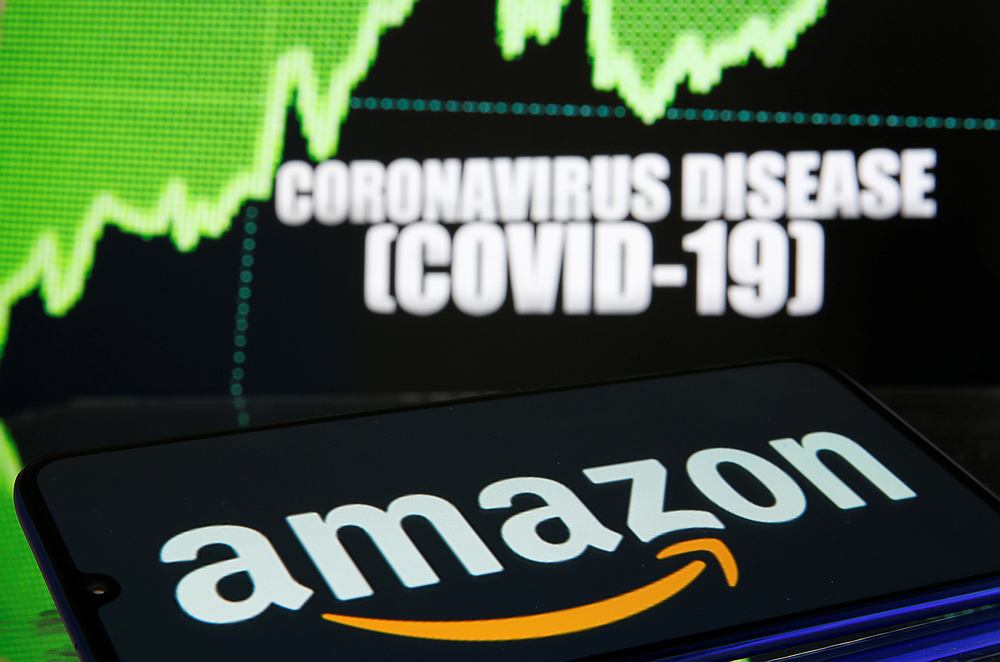 Amazon logo is seen in front of diplayed coronavirus disease in this illustration taken March 19, 2020.  u00e2u20acu201d Reuters pic