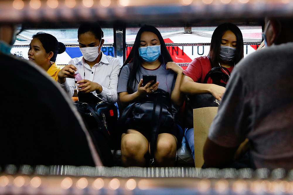 Commuters wear protective face masks inside a jeepney amid new cases of coronavirus in Manila, Philippines March 11, 2020. u00e2u20acu201d Reuters pic