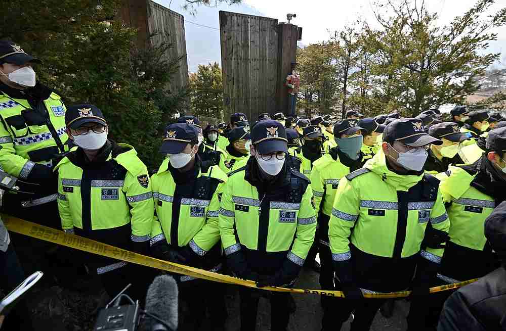 Policemen stand guard in front of a facility of the Shincheonji Church of Jesus, as journalists gather for a press conference by church founder Lee Man-hee, in Gapyeong March 2, 2020. u00e2u20acu201d AFP pic